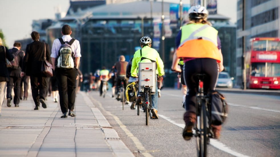 people cycling in bike lane city